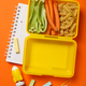 Yellow lunch box with delicious food and school supplies - PhotoDune Item for Sale