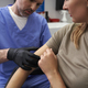 Doctor checking mark on woman&#39;s arm - PhotoDune Item for Sale