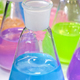 Multi-colored liquids in chemical laboratory conical flasks - PhotoDune Item for Sale