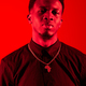Black man standing in front of red background - PhotoDune Item for Sale