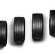 Four black car tires in a row on white background - PhotoDune Item for Sale