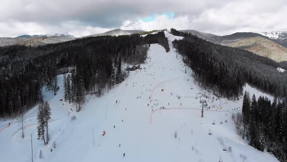 Aerial View on Ski Slopes with Skiers and Ski Lifts on Ski Resort in Winter alt