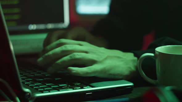 Professional Hacker Typing on Keyboard at Night Closeup of Man Hands Trying to Break Password Using alt