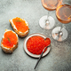 Small metal plate with red salmon caviar, two caviar toasts canape, two glasses of champagne top - PhotoDune Item for Sale