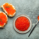 Small metal plate with red salmon caviar and two caviar toasts canape top view on grey concrete - PhotoDune Item for Sale