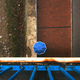 Top view of person with blue umbrella walking down the paved street on a rainy day - PhotoDune Item for Sale