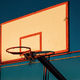Outdoor basketball board with hoops and torn net in sunset - PhotoDune Item for Sale
