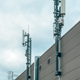 Mobile telephony base station and signal repeater antenna on industrial building - PhotoDune Item for Sale