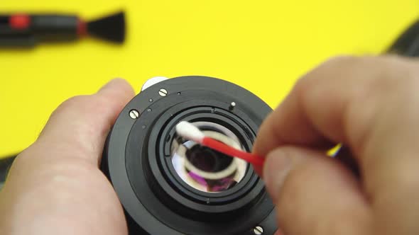 Cleaning of photographic equipment. Cleaning dust and dirt from the camera lens and sensor. alt