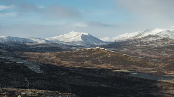 Timelapse Of Snohetta In Dovrefjell Mountains With Clouds Moving, Norway. - Zoom in alt