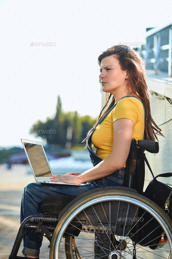 Serious girl making up a story writing a book stock photo by