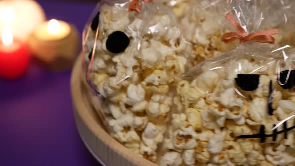 Goodies for Halloween party. Popcorn in the form of spooky skull