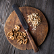 Chopped walnuts and knife on wooden plate - PhotoDune Item for Sale