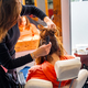 Hairdresser working with a client in a salon - PhotoDune Item for Sale