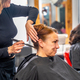 Hairdresser making an elegant bun for a client - PhotoDune Item for Sale