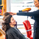 Hairdresser drying the hair of a woman in the salon - PhotoDune Item for Sale