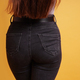 backside of woman wearing tight black denim jeans - PhotoDune Item for Sale