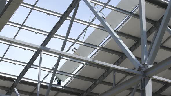 Modern Storehouse Construction Site, Structural Steel Structure of New Commercial Building Against alt