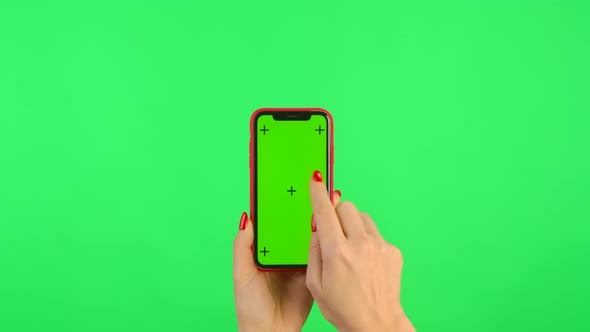 Woman Holds Mobile Phone with Workspace Mock Up Screen on Green Background alt