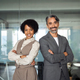 Two diverse man and woman business team stand in office arms crossed, portrait. - PhotoDune Item for Sale