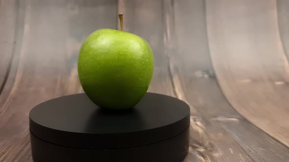 Natural Green Apple on a Wooden Background Closeup