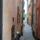 Sweden, traditional building, bike at narrow paved alley, Stockholm Gamla Stan Old Town. Vertical - PhotoDune Item for Sale