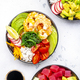Poke bowls with vegetables and seafood in assortment, white table background, top view - PhotoDune Item for Sale