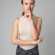 Young Woman Making a Hush Gesture on gray background in studio - PhotoDune Item for Sale