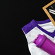 White and Purple Sports Uniform and Water Bottle Next to a Chalkboard on Black Background - PhotoDune Item for Sale