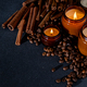 Soy scented candle in a jar. Coffee beans, anise, cinnamon spices. The candles are burning. Dark - PhotoDune Item for Sale