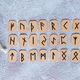 Scandinavian runes for fortune telling, pouch and candle on the table top view web banner - PhotoDune Item for Sale