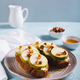 Appetizing sandwiches on rye bread with arugula, pear, honey and nuts on a plate vertical view - PhotoDune Item for Sale
