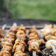 Delicious kebab roasting in fire pit close up. Meat and vegetable bbq grilling - PhotoDune Item for Sale