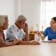 Asian caregiver nurse examine senior man and woman patient at home.  - PhotoDune Item for Sale