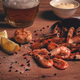 Fried shrimp in a paper bag, shrimp for beer, in a newspaper, on a wooden table, no people, - PhotoDune Item for Sale