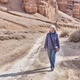 Senior Caucasian woman tourist walking along Charyn Canyon, National Natural Park in Kazakhstan. - PhotoDune Item for Sale