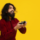 Joyful Man With Long Hair Playing Video Games - PhotoDune Item for Sale