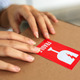 Woman Hand Sticking Fragile Mark Sticker to Parcel. - PhotoDune Item for Sale