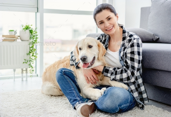 Pretty woman cuddling cute dog Stock Photo by tan4ikk | PhotoDune