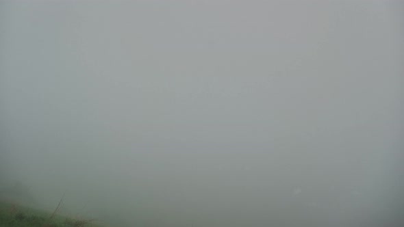 Misty Morning in a Mountain Village A Vanishing Fog Revealing a Settlement alt