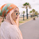 Beautiful young arab woman posing outdoors in a headscarf. Attractive female muslim wearing a hijab - PhotoDune Item for Sale