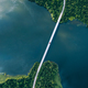 Aerial view of bridge asphalt road with cars and blue water lake and green woods - PhotoDune Item for Sale