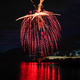 fireworks is seen above water during a party or festival show - PhotoDune Item for Sale