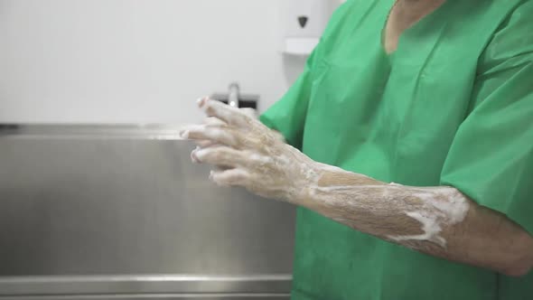 doctor washing hands before surgical procedure