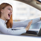 Closeup portrait of pissed off displeased angry aggressive woman driving a car - PhotoDune Item for Sale