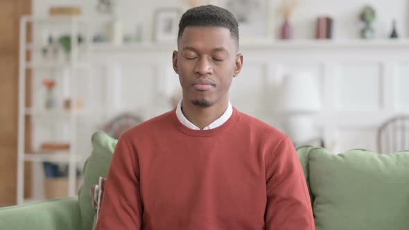 Portrait of African Man Looking at the Camera, Sad Expression alt