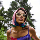 Vibrant visions: woman embracing summer in colorful dress and sunglasses - PhotoDune Item for Sale