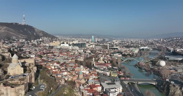 Aerial view of Metekhi church in old Tbilisi located on cliff near river Kura. Georgia 2022 winter alt