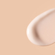 cosmetic smear of creamy texture on a beige background - PhotoDune Item for Sale
