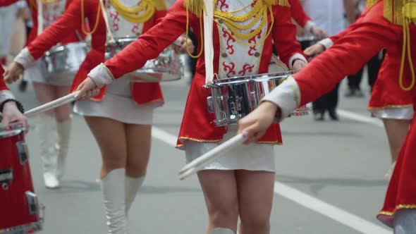 Young Girls Drummer in Red Vintage Uniform at the Parade alt